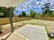 Expansive backyard, enclosed by a wooden fence, with a concrete patio and emerging spring foliage at 247 Jenkins St, Erwin, NC 28334