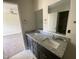Bathroom featuring a double vanity, granite countertops, and tile flooring at 247 Jenkins St, Erwin, NC 28334