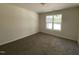 Bright bedroom with natural light, neutral walls, and plush carpeting provides a comfortable retreat at 247 Jenkins St, Erwin, NC 28334