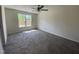 Cozy bedroom with plush carpeting, a large window, and neutral wall color at 247 Jenkins St, Erwin, NC 28334