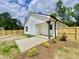 Charming home with a well-manicured lawn, covered porch, and fenced backyard, blending comfort and style at 247 Jenkins St, Erwin, NC 28334