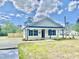 Classic home with inviting front porch, well-maintained lawn, and charming curb appeal, great for families at 247 Jenkins St, Erwin, NC 28334