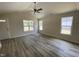 Inviting living room featuring a ceiling fan, plenty of natural light, and neutral paint at 247 Jenkins St, Erwin, NC 28334
