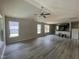 Bright and spacious living room with vaulted ceilings, modern flooring, and large windows at 247 Jenkins St, Erwin, NC 28334