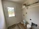 Mud room featuring a door to the backyard, a shelf and a utility sink hookups at 247 Jenkins St, Erwin, NC 28334