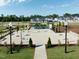 Aerial view showcases the community area with cornhole, outdoor seating, and beautiful landscaping at 191 Anise Ln, Garner, NC 27529