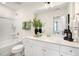 Well-lit bathroom features a white vanity, a large mirror, and a shower-tub combo with contemporary fixtures at 191 Anise Ln, Garner, NC 27529
