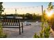Outdoor community space featuring cornhole boards and a comfortable bench under festive string lights at 191 Anise Ln, Garner, NC 27529