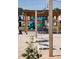 Community recreation area with playground, cornhole game, string lights, and picnic tables at 191 Anise Ln, Garner, NC 27529