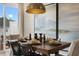 Well-lit dining room features a wooden table, stylish chairs, and large windows with a view to the outside at 191 Anise Ln, Garner, NC 27529