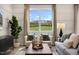 Inviting living room with large windows offering a view, modern decor, and cozy seating for a relaxing atmosphere at 191 Anise Ln, Garner, NC 27529