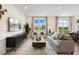 Comfortable living room featuring a large window, modern decor, and an open layout, perfect for relaxation and entertainment at 191 Anise Ln, Garner, NC 27529