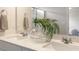 Bathroom featuring a double sink vanity with quartz countertops and modern fixtures at 195 Anise Ln, Garner, NC 27529