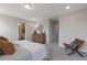 Bedroom showcasing a decorative mirror and dresser leading to a glimpse of the bathroom at 195 Anise Ln, Garner, NC 27529