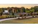Beautiful community pergola with seating area surrounded by landscaping, ideal for outdoor gatherings at 195 Anise Ln, Garner, NC 27529