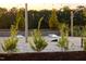 View of the community area featuring cornhole games and landscaping at 195 Anise Ln, Garner, NC 27529