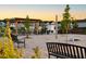 Evening view of community area featuring picnic tables, pergola, cornhole boards, and landscaping at 195 Anise Ln, Garner, NC 27529