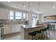 Modern kitchen boasts a large island with bar seating, granite countertops and stainless steel appliances at 195 Anise Ln, Garner, NC 27529