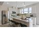 Modern kitchen featuring white cabinetry, granite counters, stainless steel appliances, and a large island at 195 Anise Ln, Garner, NC 27529
