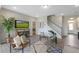 Bright living room featuring contemporary decor, neutral walls, and hardwood floors at 195 Anise Ln, Garner, NC 27529