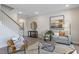 Open-concept living area with staircase, stylish decor, and a comfortable seating arrangement on an area rug at 195 Anise Ln, Garner, NC 27529