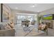Open concept living area featuring a modern kitchen, hardwood floors, and contemporary decor at 195 Anise Ln, Garner, NC 27529