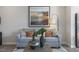 Comfortable living room features a plush gray sofa with decorative pillows and stylish coffee table decor at 195 Anise Ln, Garner, NC 27529