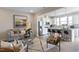 Open concept living room and kitchen area featuring hardwood floors, neutral paint, and stainless steel appliances at 195 Anise Ln, Garner, NC 27529