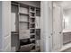 Walk-in closet with custom shelving, built-in drawers, and ample hanging space, offering organized storage at 620 Wade Ave # 301, Raleigh, NC 27605