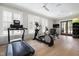 Well-equipped gym featuring modern exercise machines, natural light, and ceiling fans for a comfortable workout at 620 Wade Ave # 301, Raleigh, NC 27605