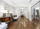 Elegant hallway featuring herringbone wood floors, stylish decor, and a seamless transition to the adjacent rooms at 620 Wade Ave # 301, Raleigh, NC 27605