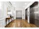 Bright hallway featuring herringbone wood floors, an elevator, stylish decor, and seamless transitions at 620 Wade Ave # 301, Raleigh, NC 27605