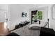 Modern office space with hardwood floors, a large window, chaise lounge, and contemporary furnishings at 620 Wade Ave # 301, Raleigh, NC 27605
