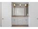 Ensuite bathroom features double vanity and framed mirrors at 836 Bankston Woods Way, Raleigh, NC 27609