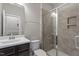 Bathroom featuring a black vanity, modern tiles, and a glass enclosed shower at 836 Bankston Woods Way, Raleigh, NC 27609