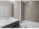 Bathroom featuring a black vanity, modern tiles, and a shower/tub combo at 836 Bankston Woods Way, Raleigh, NC 27609