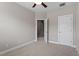 Bedroom featuring a ceiling fan, neutral paint, carpet, and a view into the hallway at 836 Bankston Woods Way, Raleigh, NC 27609