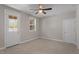 Bedroom with carpet, ceiling fan, natural light, and access to the outdoors at 836 Bankston Woods Way, Raleigh, NC 27609