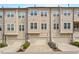 Attractive townhouse exterior featuring attached garages, neutral siding, and well-maintained landscaping at 836 Bankston Woods Way, Raleigh, NC 27609