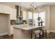 This beautifully staged kitchen features stainless steel appliances, a gray backsplash and a large island with seating at 836 Bankston Woods Way, Raleigh, NC 27609