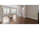 Spacious living room with hardwood floors, modern kitchen and recessed lighting at 836 Bankston Woods Way, Raleigh, NC 27609
