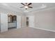 Spacious main bedroom with tray ceiling, ensuite bathroom, and walk-in closet at 836 Bankston Woods Way, Raleigh, NC 27609
