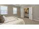 Bright main bedroom featuring large windows and ensuite bathroom entrance at 836 Bankston Woods Way, Raleigh, NC 27609
