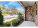Charming neighborhood street view framed by a stone archway and lush landscaping at 836 Bankston Woods Way, Raleigh, NC 27609