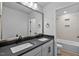 Elegant bathroom boasts a double vanity with sleek countertops and a separate shower and bathtub area at 2820 Lacy Holt Rd, Graham, NC 27253