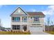 Charming two-story home with a welcoming front porch and attached two-car garage at 2820 Lacy Holt Rd, Graham, NC 27253