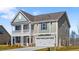 Attractive home featuring a two-car garage and a cozy balcony on the second floor at 2820 Lacy Holt Rd, Graham, NC 27253