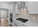 Well-equipped kitchen showcasing stainless steel appliances and sleek countertops, with modern lighting at 2820 Lacy Holt Rd, Graham, NC 27253
