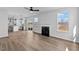 Open-concept living space with a fireplace, seamless flow from kitchen to living room, with lots of natural light at 2820 Lacy Holt Rd, Graham, NC 27253