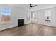 Light-filled living room with hardwood floors, a fireplace, recessed lights and plenty of natural light at 2820 Lacy Holt Rd, Graham, NC 27253